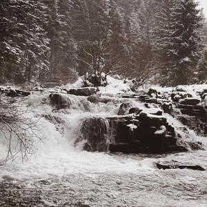 Mountain River In A Snowfall