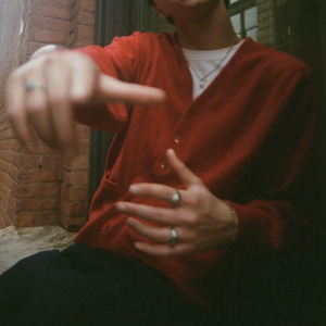 ได้โปรด (on his behalf)