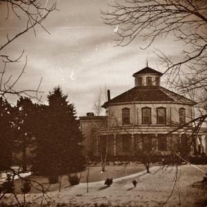 Cigarettos On Ottomans (In Smoking Jackets)