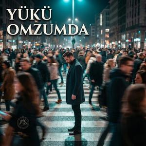 YÜKÜ OMZUMDA