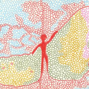 坐在白色的大树下面