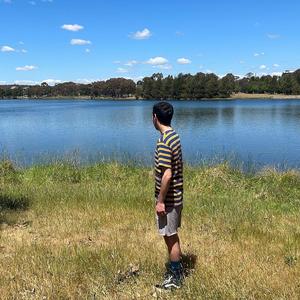 I was riding my bike and saw a guy selling watermelons on the side of the road
