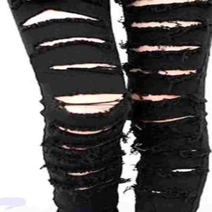 The self mutilation under my black skinny jeans seeps into the fabric forming my bond with abnormality