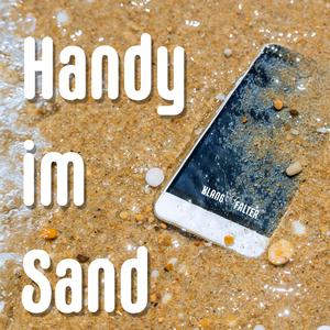 Handy im Sand