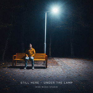 STILL HERE UNDER THE LAMP