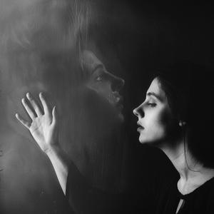 Just Out of Reach, My Fingers Brush the Dreamer's Cheek as She Wakes and Forgets the Life We Shared