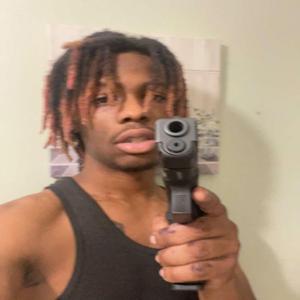 BLACK DUDE AND A GUN