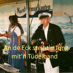 An de Eck steiht'n Jung mit'n Tüdelband